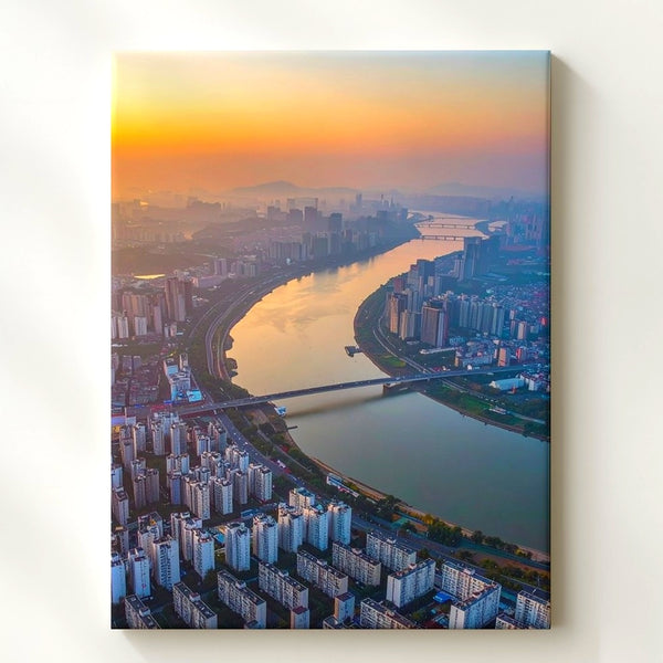 Sunrise Cityscape Canvas – Aerial View of Urban Metropolis and Calm River