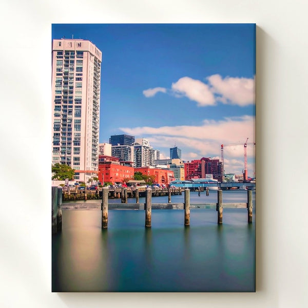 Waterfront Cityscape Canvas – Modern Architecture with Colorful Buildings and Pylons