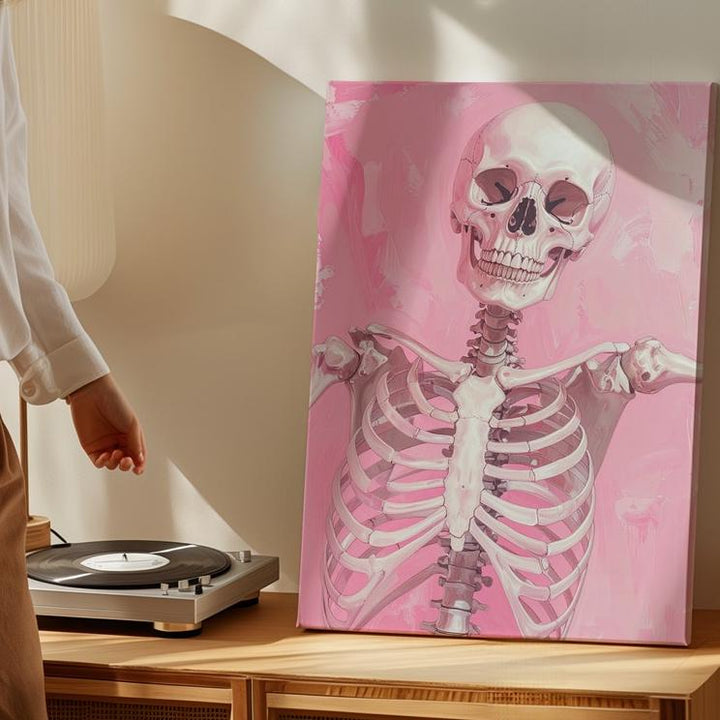Carefree Skeleton Canvas – Playful Pose & Soft Pink Background Art - Gifitto